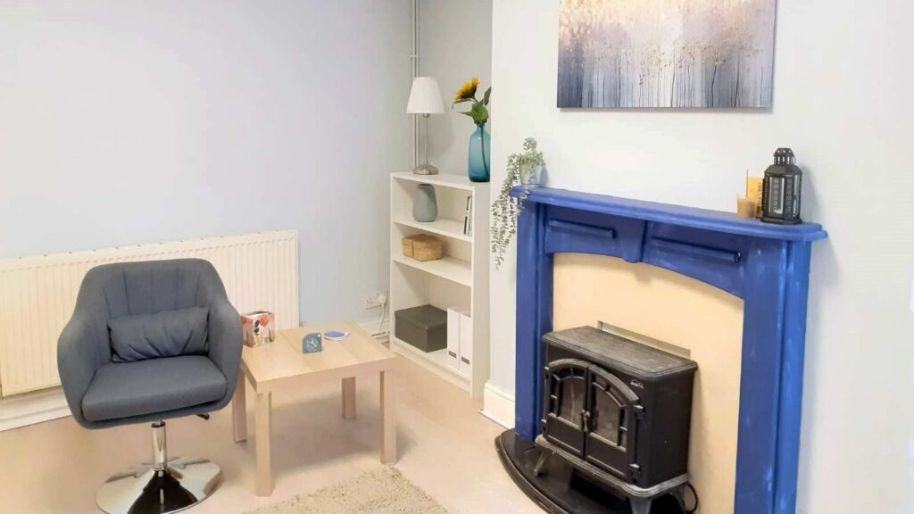 Room with fireplace at Whitefield & Radcliffe Holistic Centre