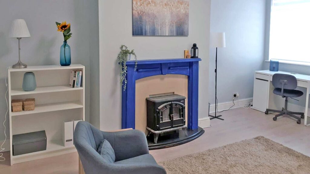 Whitefield and Radcliffe Holistic Centre - Room with blue fireplace